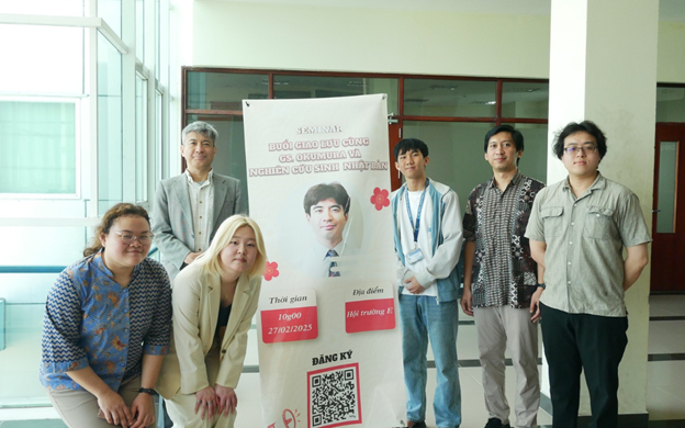 A group of people standing next to a poster

AI-generated content may be incorrect.